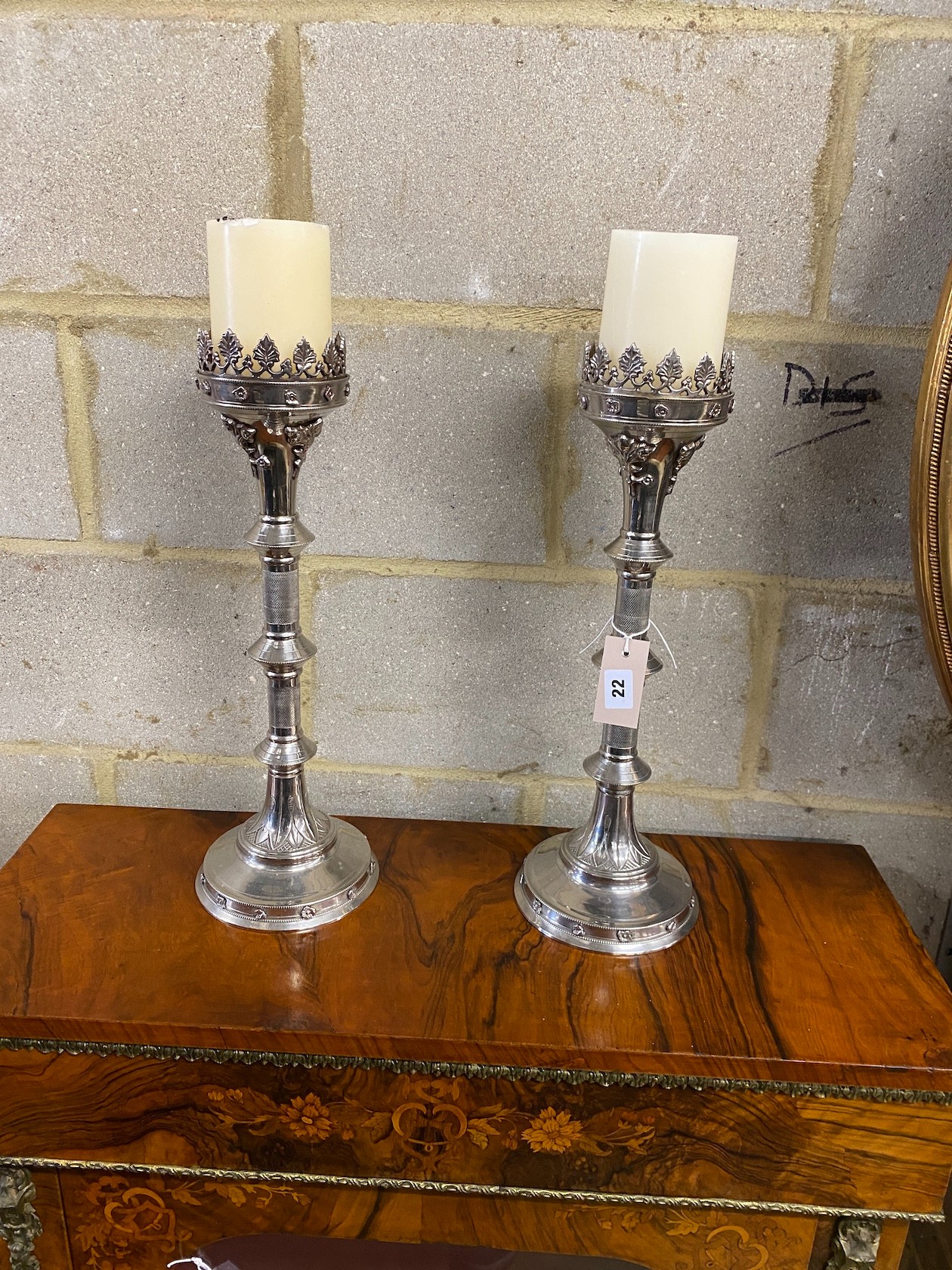A pair of 17th century style pricket candlesticks, height 48cm